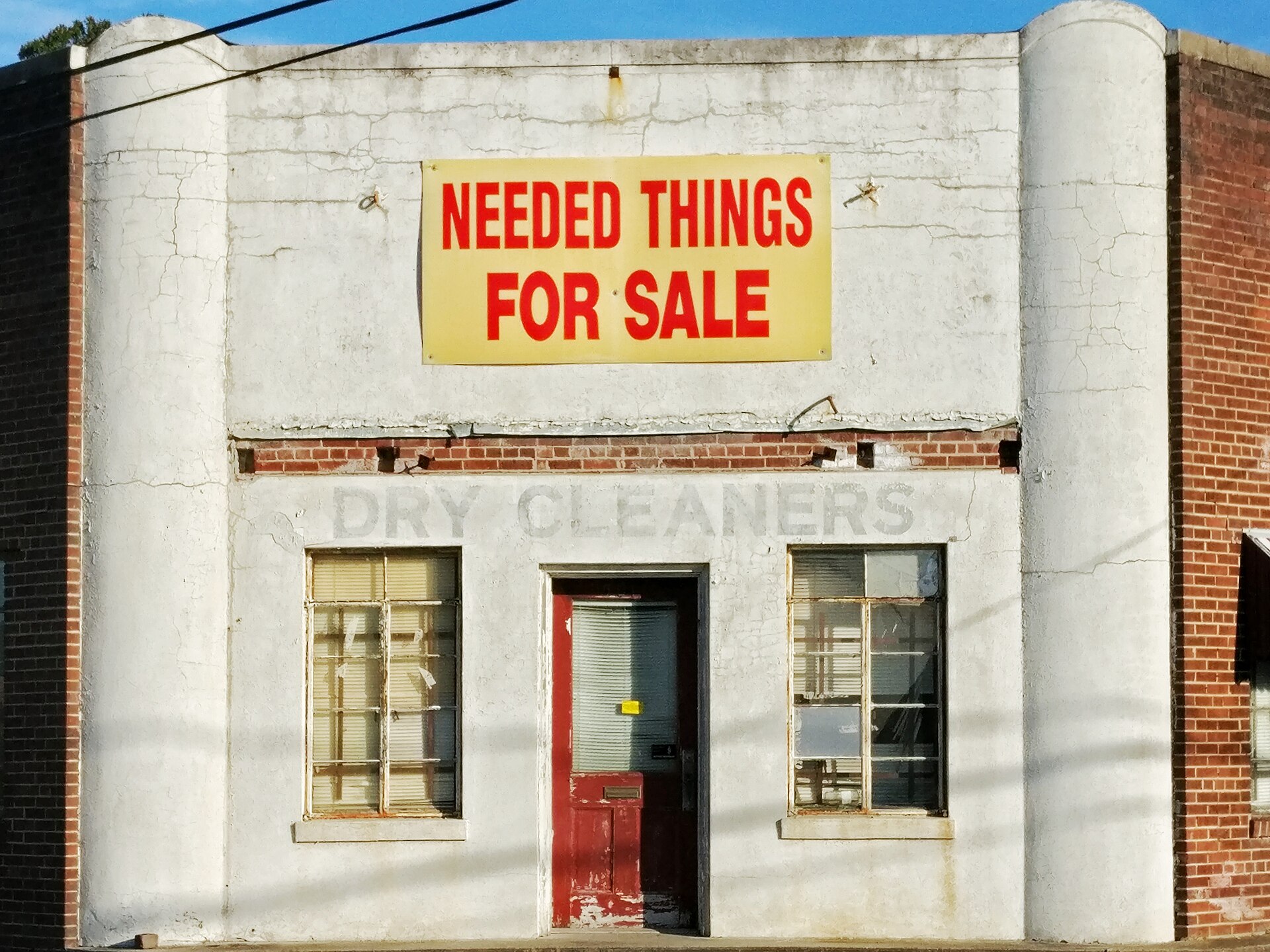 Old dry cleaner's storefront (Unsplash)