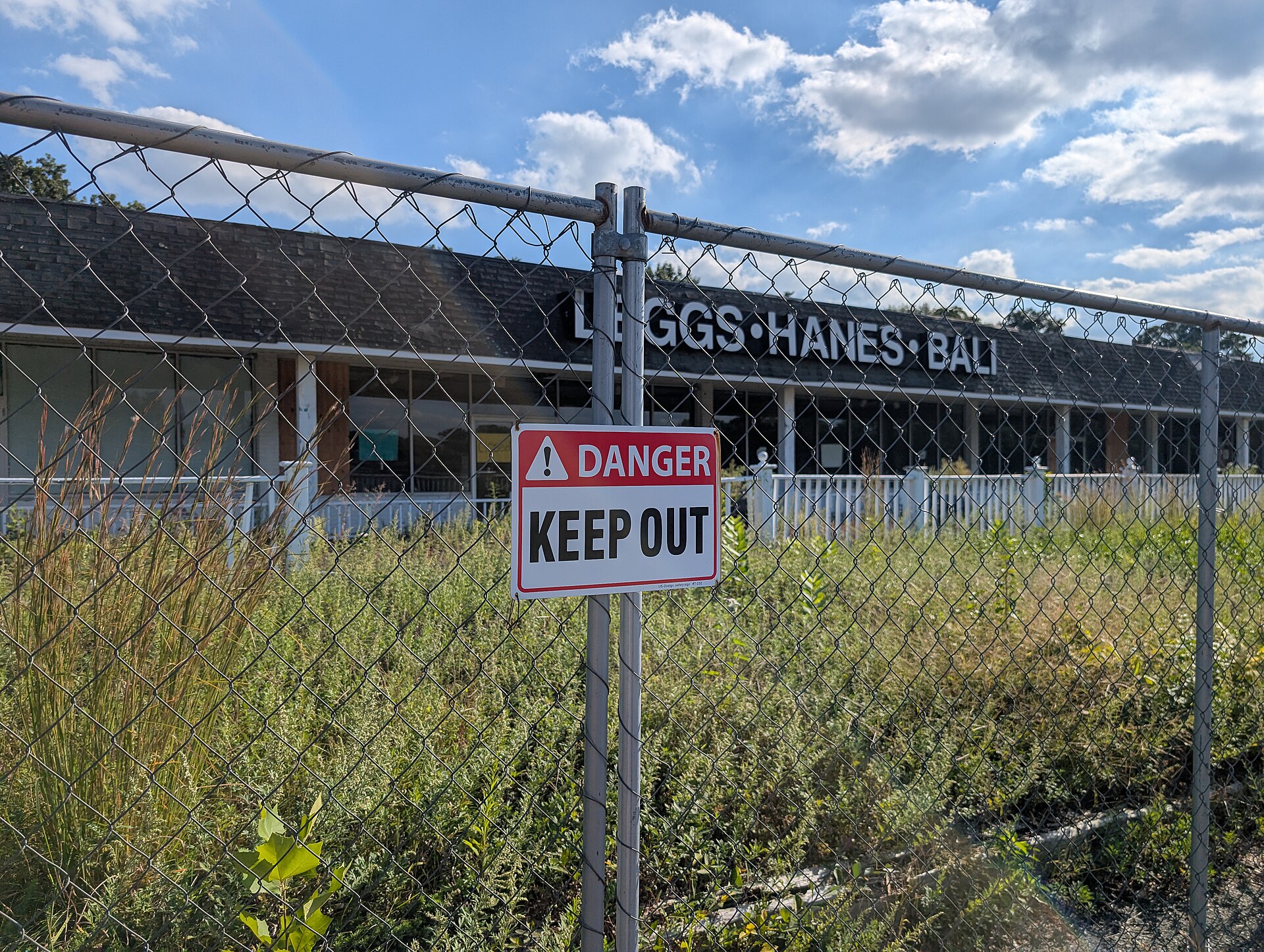 Keep Out sign in front of the abandoned L'Eggs–Hanes–Bali storefront