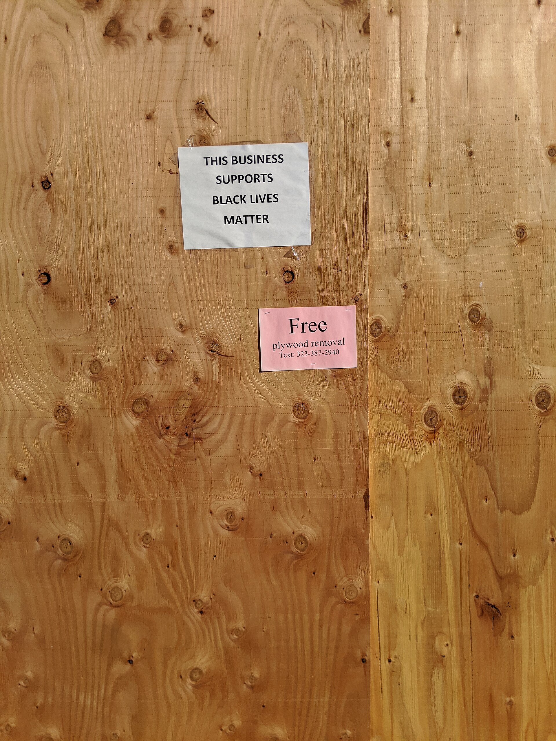 Free plywood removal sign, boarded up storefront, Magnolia Park, Burbank, California, USA (50007460971)